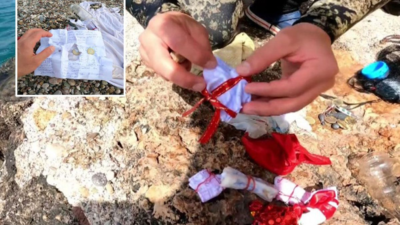 Antalya'da Hıdırellez gecesi denize atılan dilek kağıtları ve poşetler, dalgıçlar